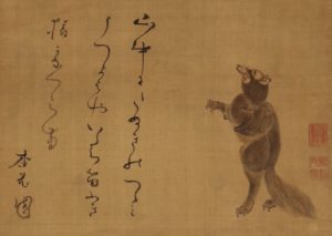 Old painting of tanuki standing on hind legs