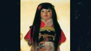A haunted Japanese doll named Okiku, with long black hair and a traditional Japanese kimono.