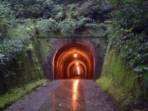 A tunnel with a light at the end, representing hope and new beginnings. Or maybe not. It could be haunted.